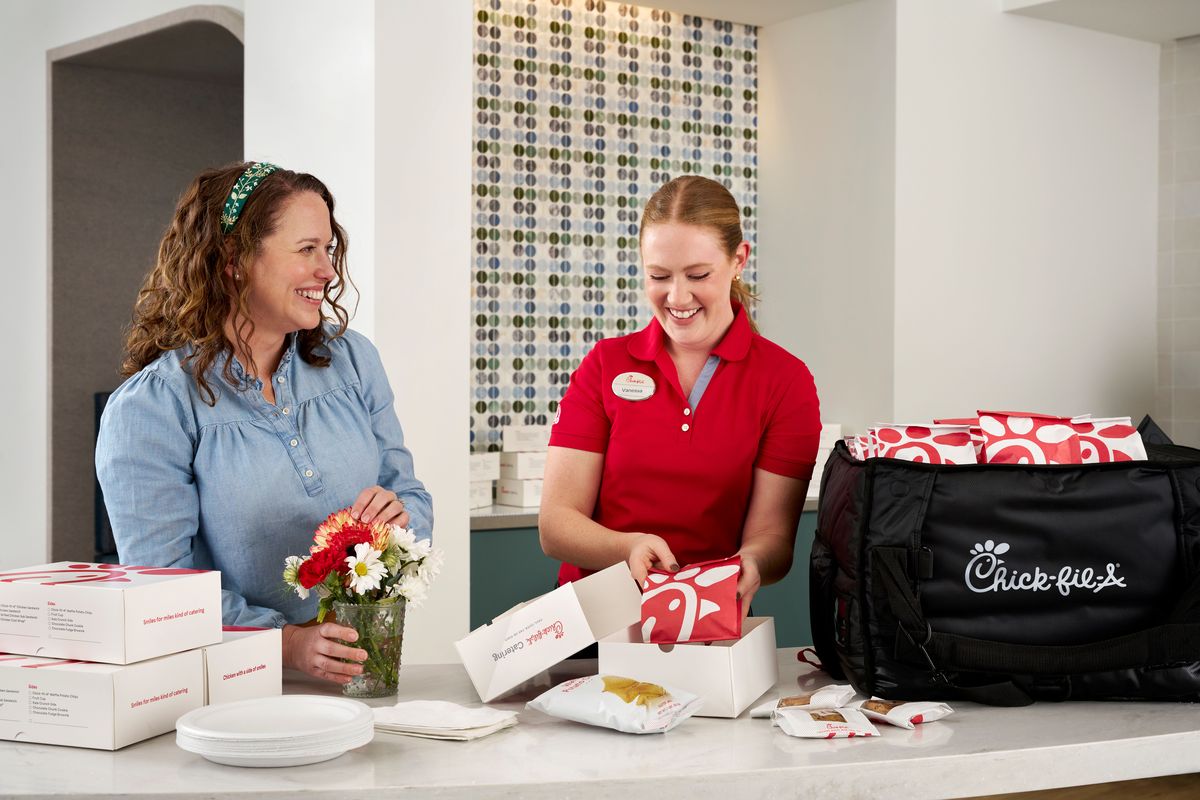 Chick-fil-A team member with a catering delivery